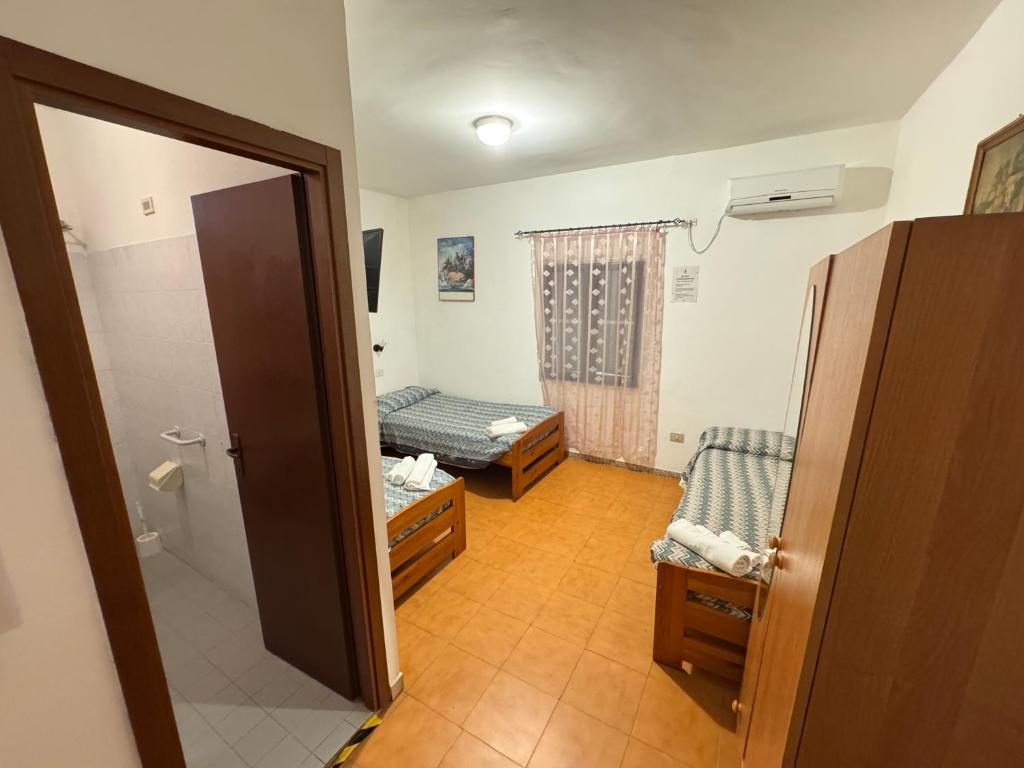 Postel nebo postele na pokoji v ubytování Hotel Paradiso