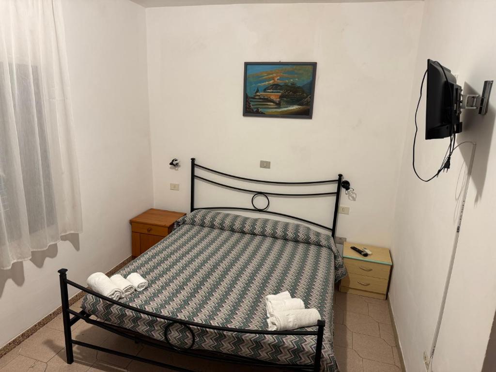 Postel nebo postele na pokoji v ubytování Hotel Paradiso