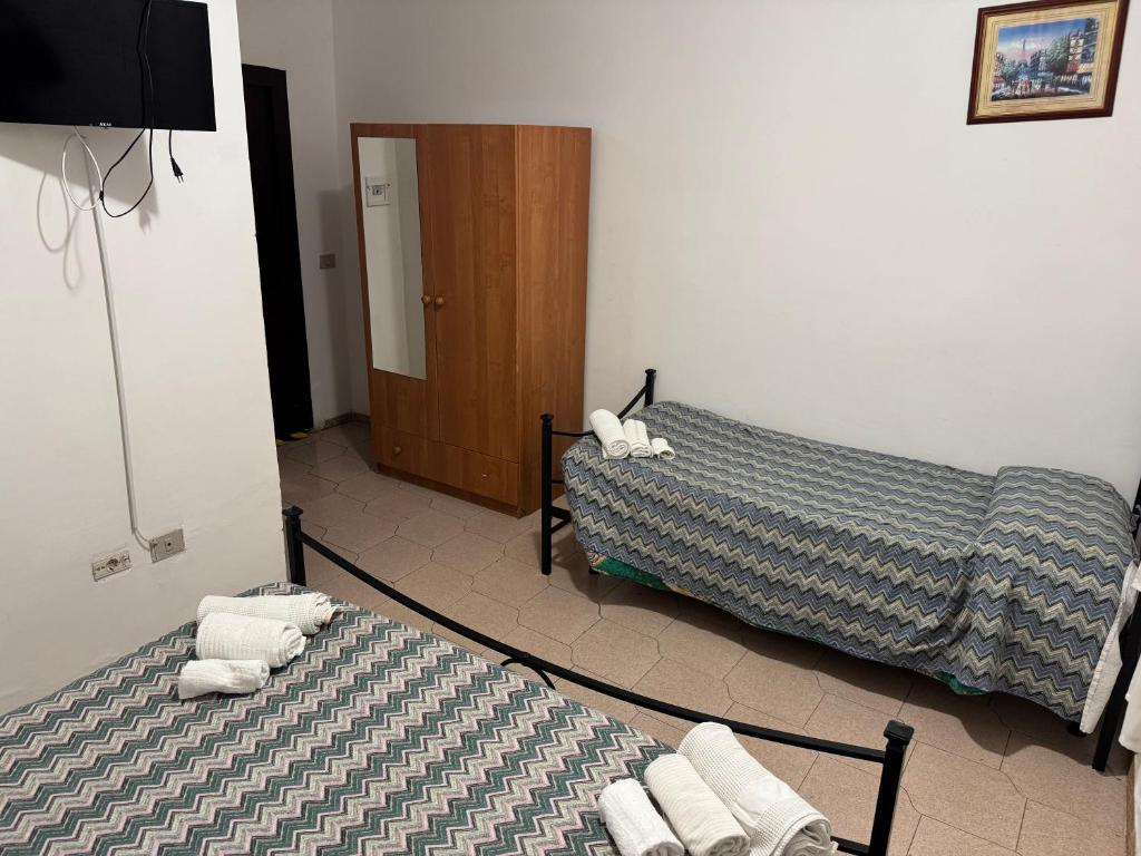 Postel nebo postele na pokoji v ubytování Hotel Paradiso