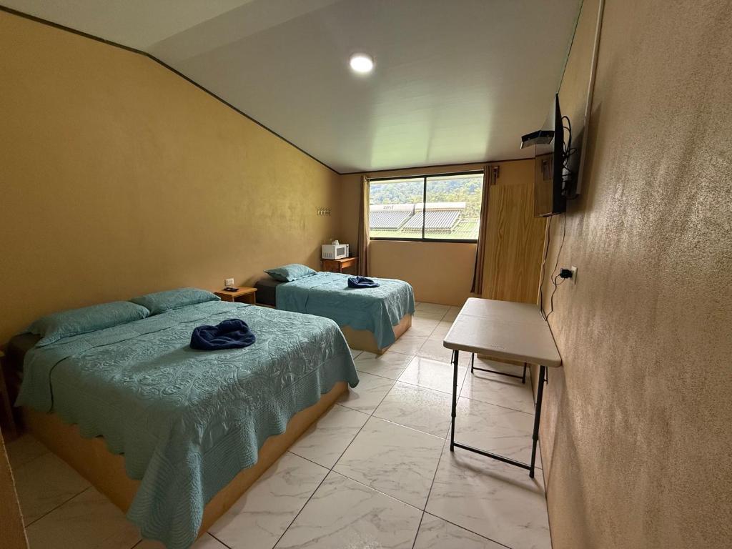 Postel nebo postele na pokoji v ubytování Hotel Uran