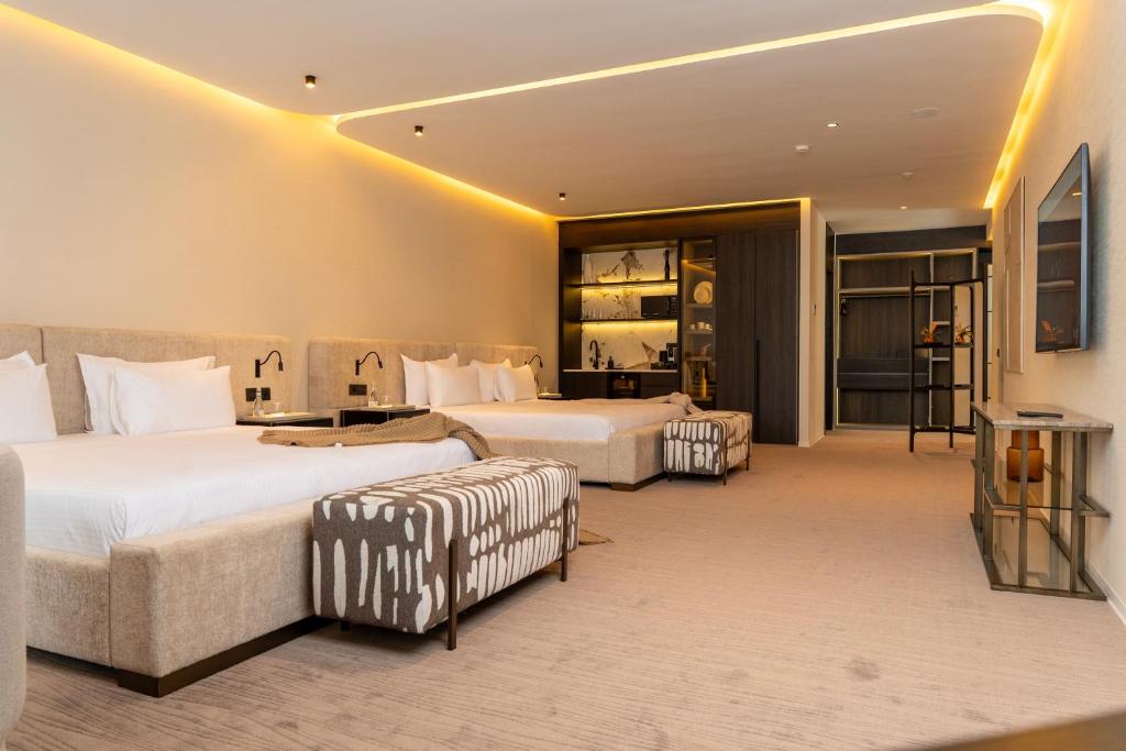 Letto o letti in una camera di Suites By Le Rêve
