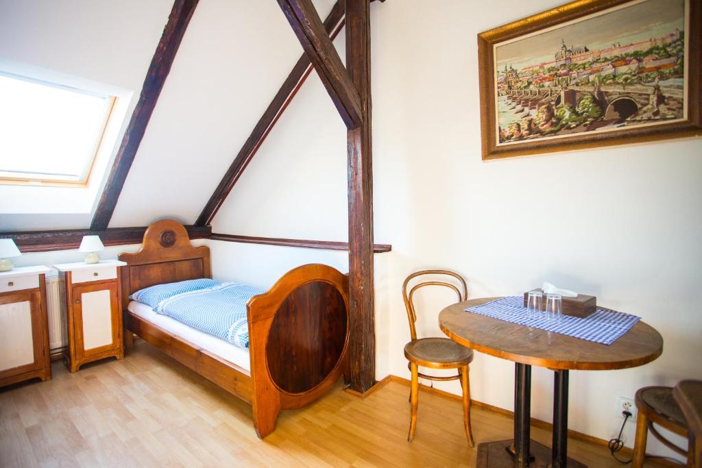 Postel nebo postele na pokoji v ubytování Penzion Ctrnactka