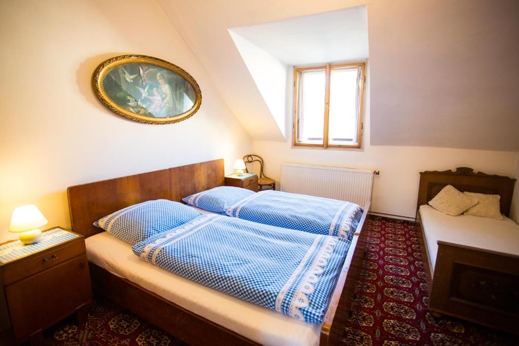 Postel nebo postele na pokoji v ubytování Penzion Ctrnactka