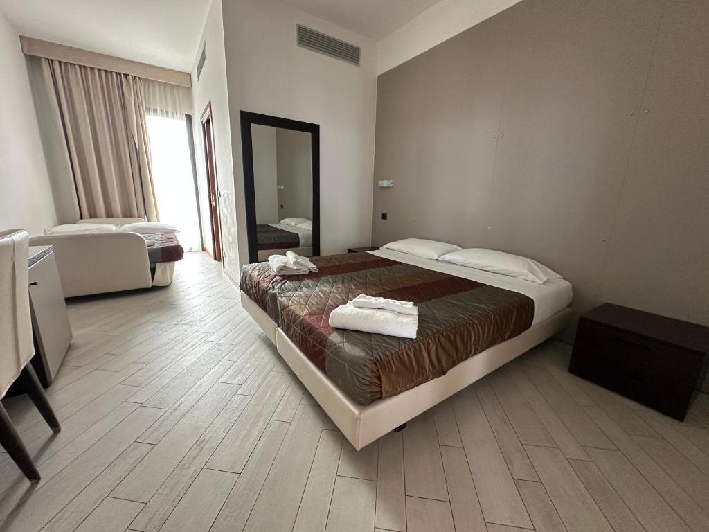 Postel nebo postele na pokoji v ubytování Hotel San Clemente