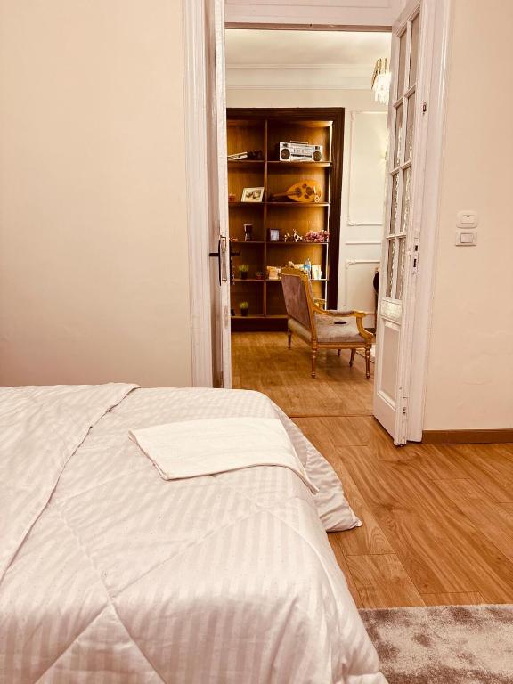 Postel nebo postele na pokoji v ubytování La Palaise du Caire