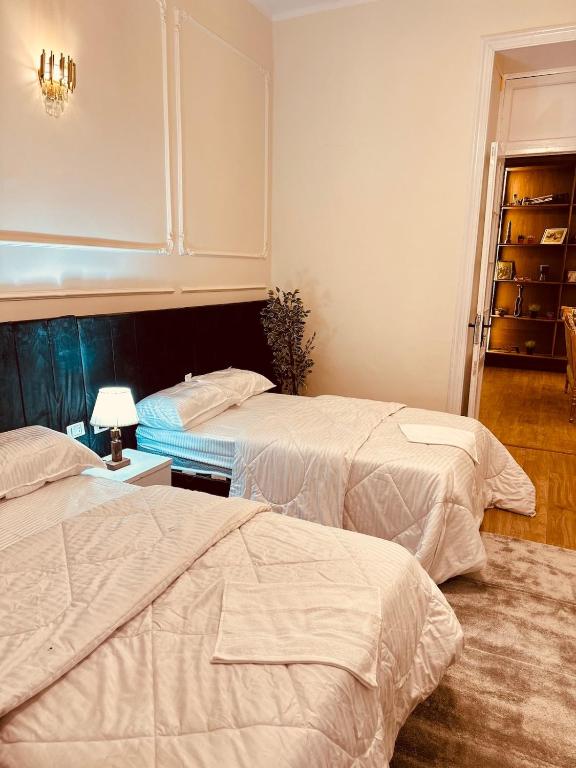 Postel nebo postele na pokoji v ubytování La Palaise du Caire
