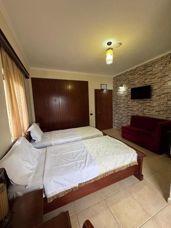 Postel nebo postele na pokoji v ubytování HOTEL RESTORANT LEZA