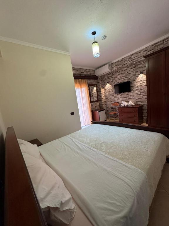 Postel nebo postele na pokoji v ubytování HOTEL RESTORANT LEZA