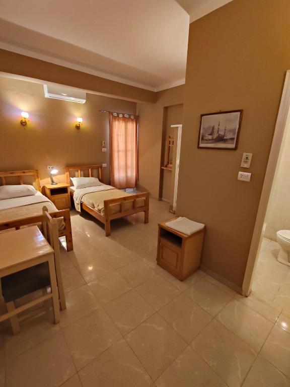 Postel nebo postele na pokoji v ubytování KR Hotel