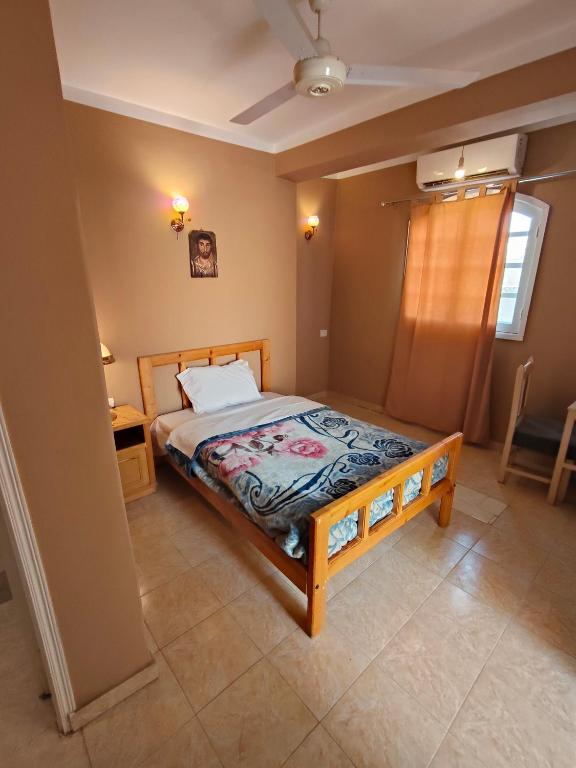Postel nebo postele na pokoji v ubytování KR Hotel