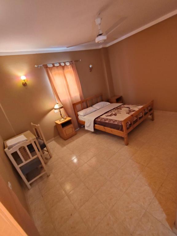 Postel nebo postele na pokoji v ubytování KR Hotel