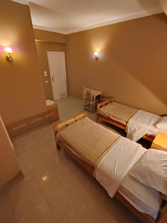 Postel nebo postele na pokoji v ubytování KR Hotel