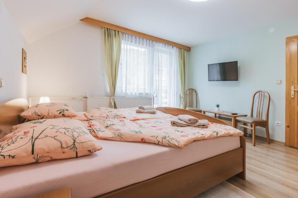 A bed or beds in a room at Rooms Zupančič