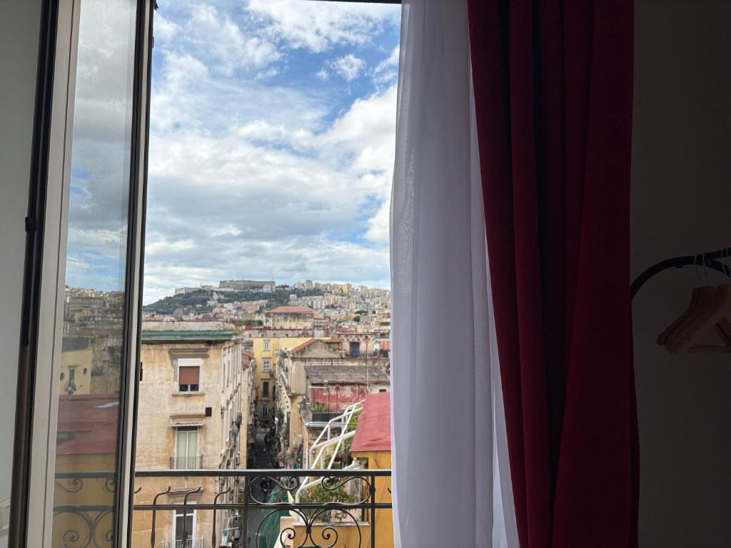 a view of a city from a window at B&B Tarumbò in Naples