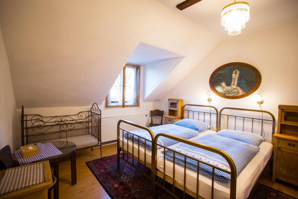 Postel nebo postele na pokoji v ubytování Penzion Ctrnactka