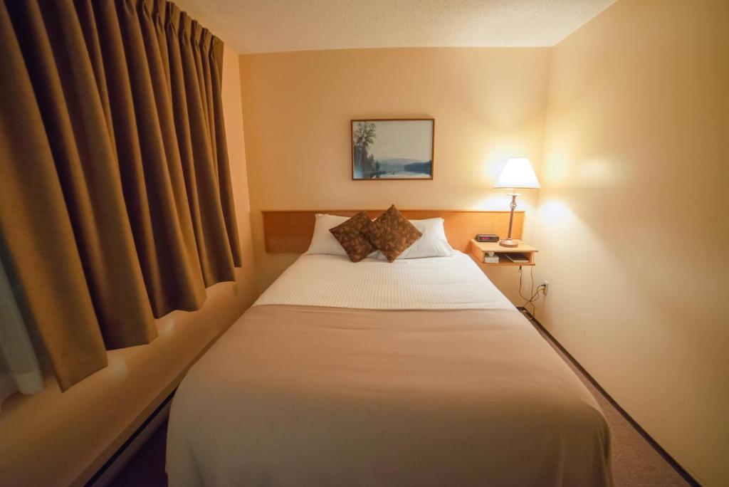 Postel nebo postele na pokoji v ubytování Northway Motor Inn