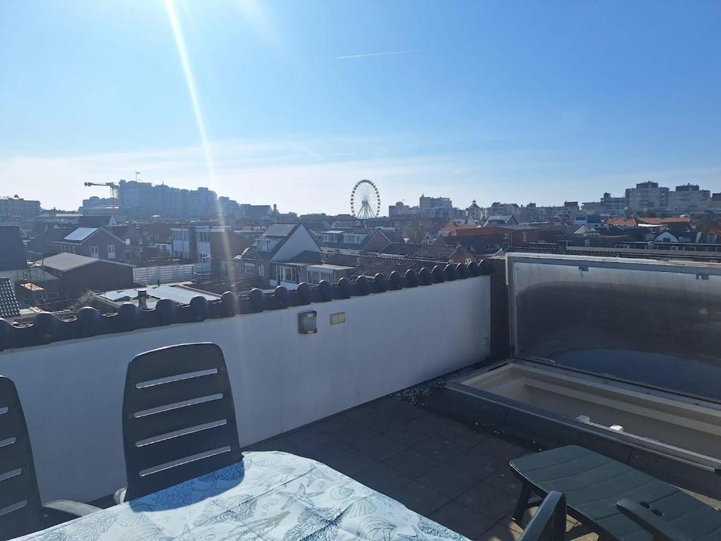 a balcony with a view of a city at Have a nice stay! - Juul's Rooftop, free parking in Noordwijk