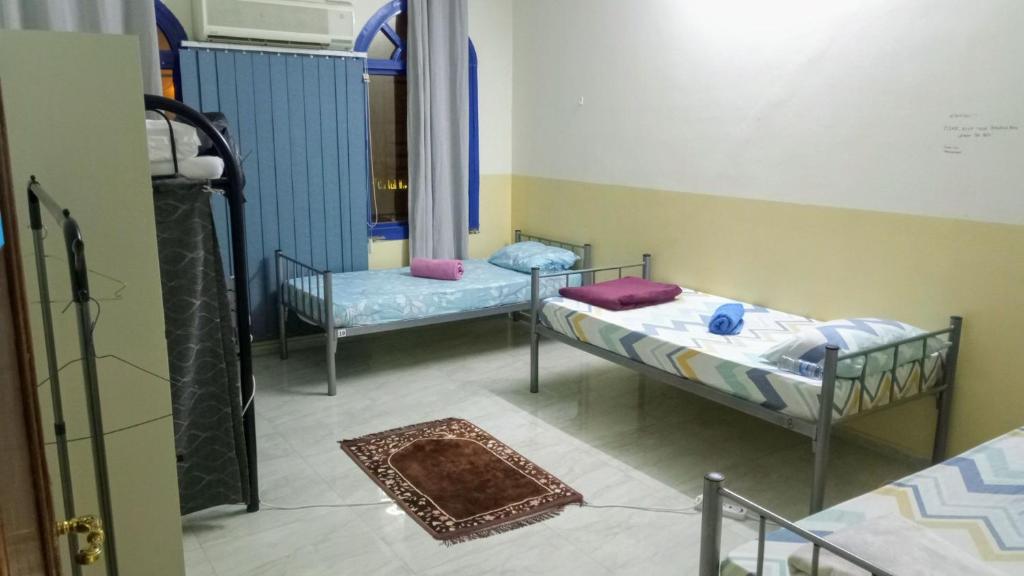 Postel nebo postele na pokoji v ubytování SALEM House Hostel Nizwa