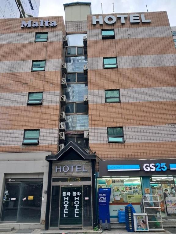 a building with a hotel in front of it at Yeoksam Molta 2 in Seoul