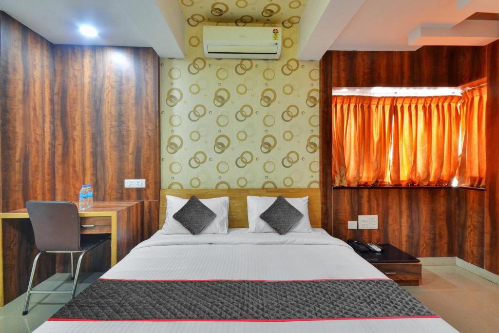 Postel nebo postele na pokoji v ubytování Super Townhouse Coastal Grand Hotels and Resorts