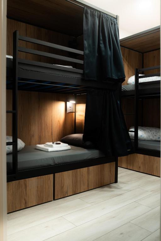 two bunk beds are in a room with at Only for Women Hostel Madrid-Sol in Madrid