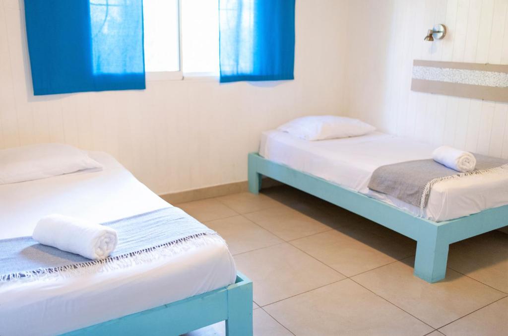 Postel nebo postele na pokoji v ubytování Boho lodge Montezuma l&l