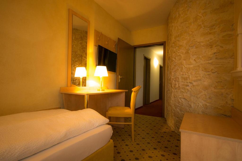 Postel nebo postele na pokoji v ubytování Hotel-Restaurant Alpha