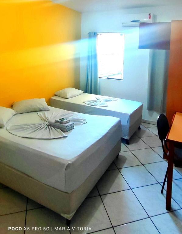 Cama o camas de una habitación en Avenida Plaza Hotel