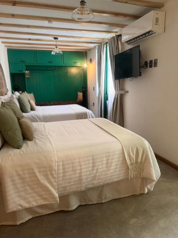 Postel nebo postele na pokoji v ubytování Casa Moseua