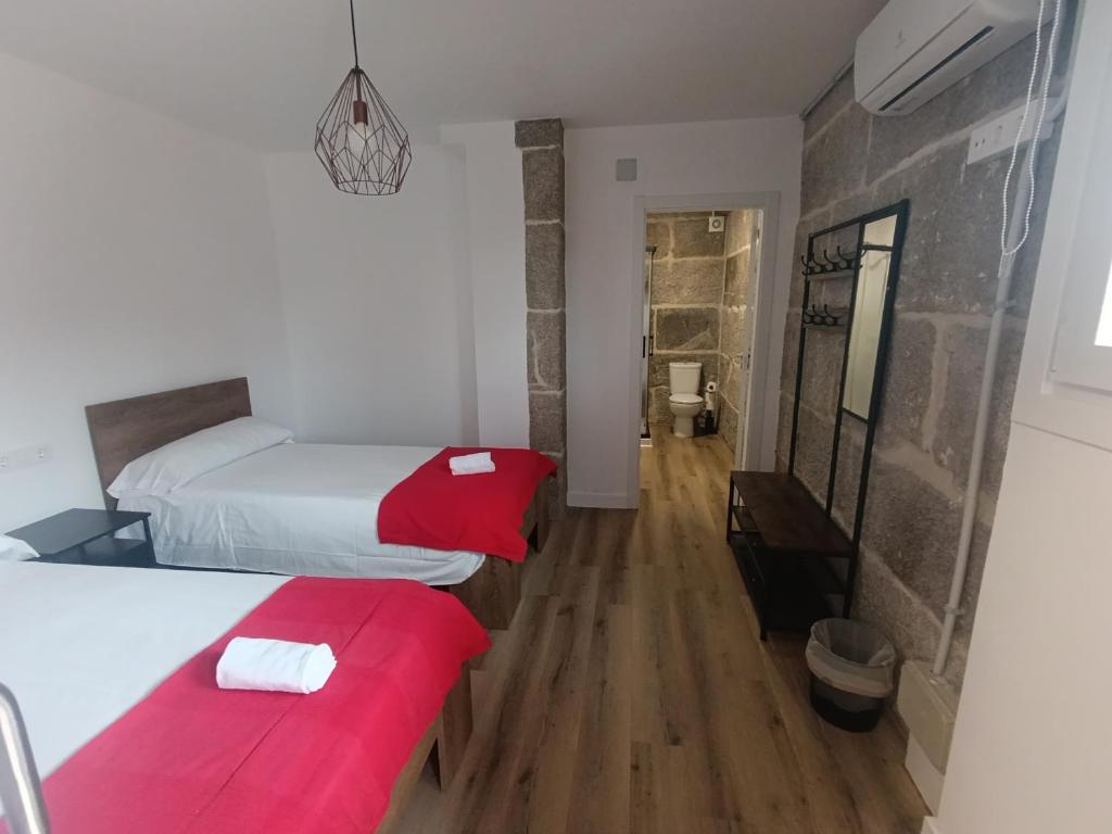 Postel nebo postele na pokoji v ubytování Albergue Villa San Clemente