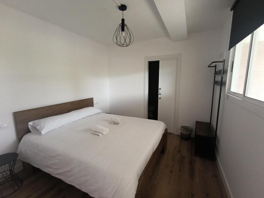 Postel nebo postele na pokoji v ubytování Albergue Villa San Clemente