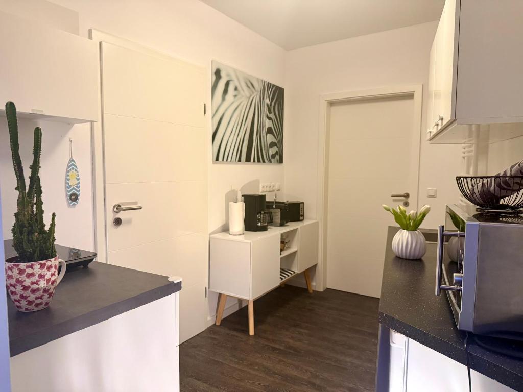 Kuchyň nebo kuchyňský kout v ubytování Appartement-Boergerende