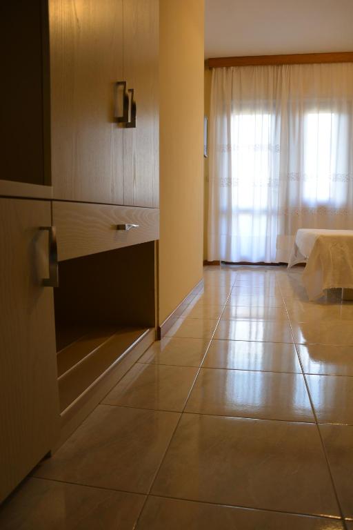 Postel nebo postele na pokoji v ubytování Hotel Giotto