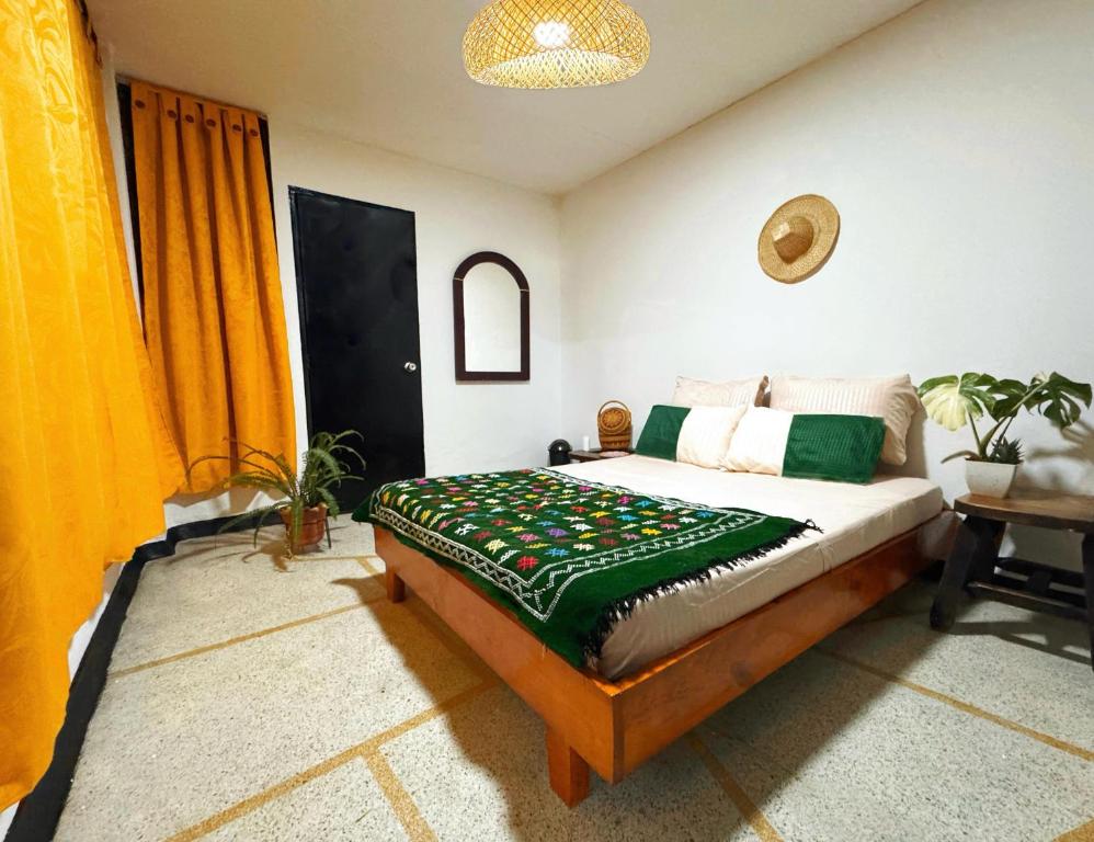 En eller flere senger på et rom på La Chiva Hostal Armenia