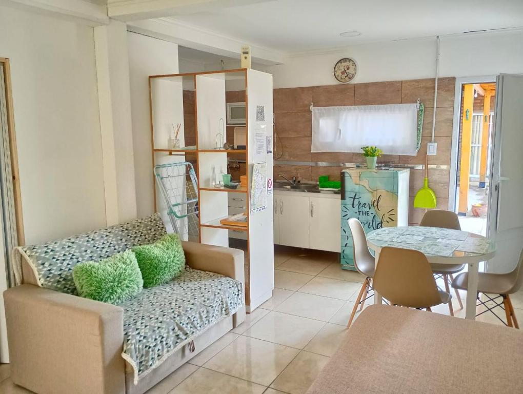 a living room with a couch and a table at Bethel Alojamiento in Zapala