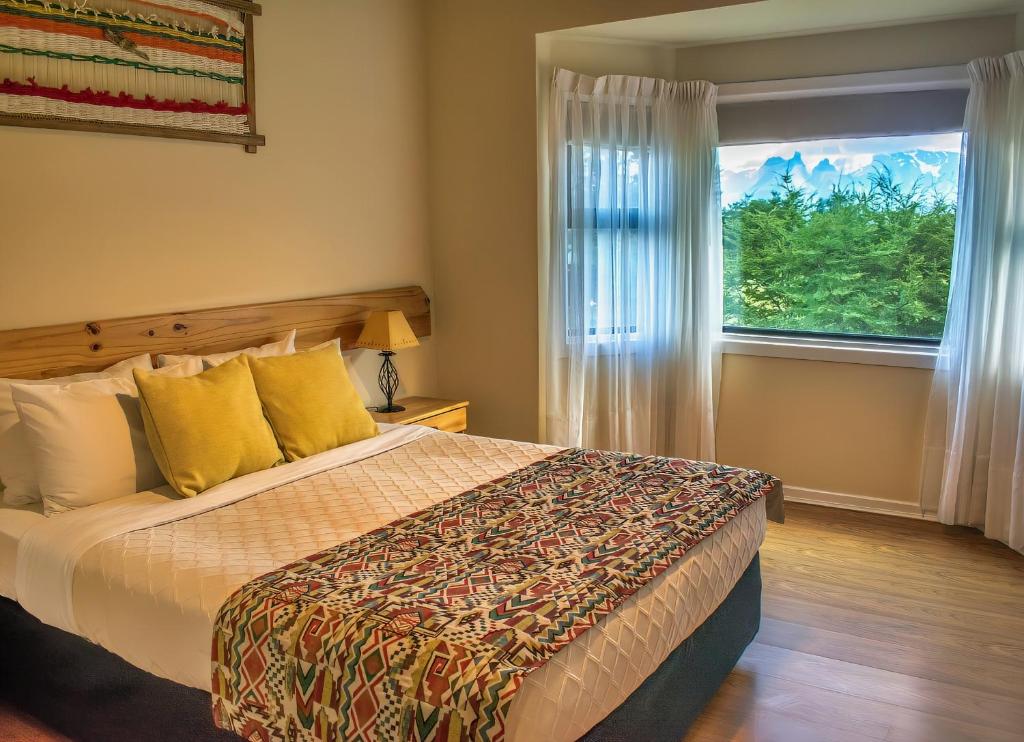 Postel nebo postele na pokoji v ubytování Hotel del Paine