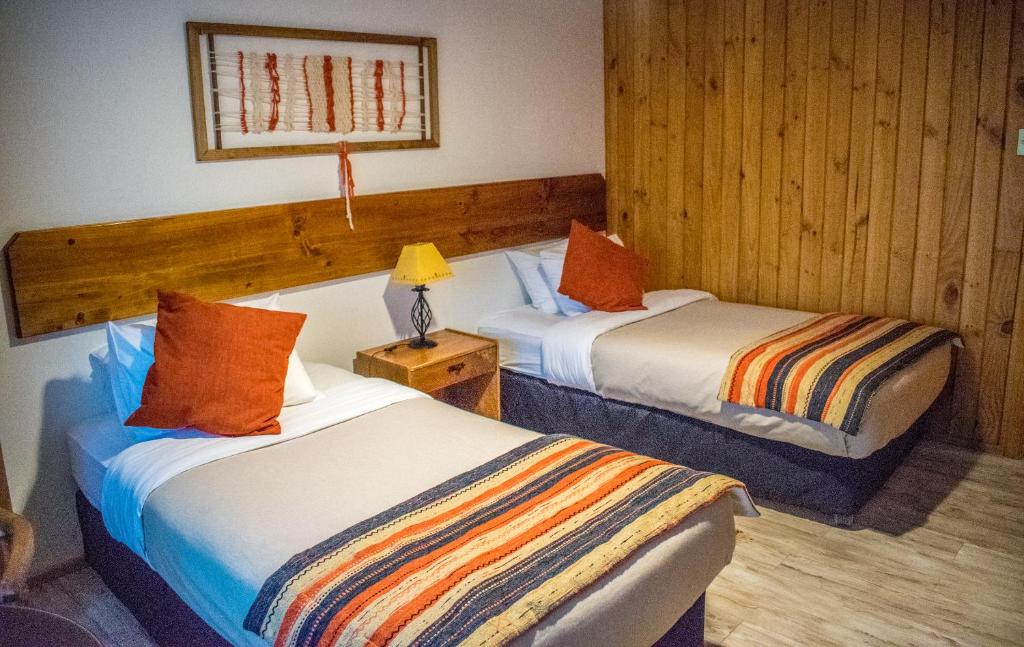 Postel nebo postele na pokoji v ubytování Hotel del Paine