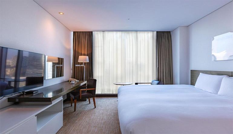 Postel nebo postele na pokoji v ubytování Orakai Songdo Park Hotel
