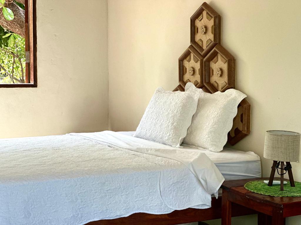 Ένα ή περισσότερα κρεβάτια σε δωμάτιο στο Casa Ingapura Garden Suite - Povoado Bar da Hora - 15 minutos de canoa para Atins - Estilo B&B - Café da Manhã Simples - Conforto