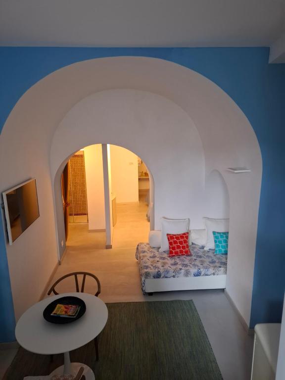Televízia a/alebo spoločenská miestnosť v ubytovaní Casa Capri Mores