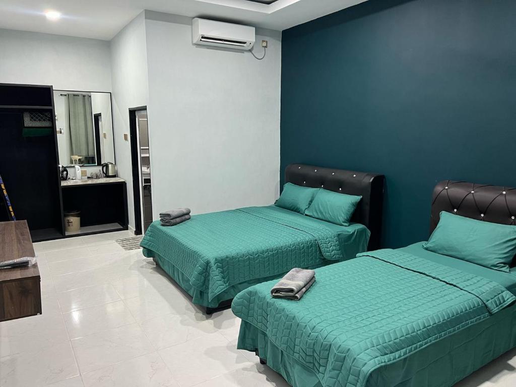 Postel nebo postele na pokoji v ubytování HMI Roomstay