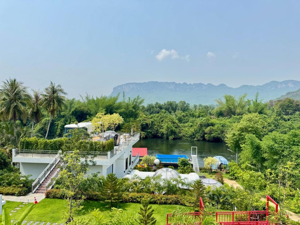 an aerial view of the resort and the river at เดอะเบสแคปซูล รีสอร์ท in Ban Tha Manao