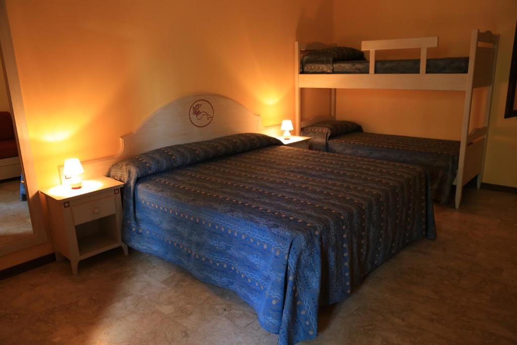 Postel nebo postele na pokoji v ubytování Hotel Oriente