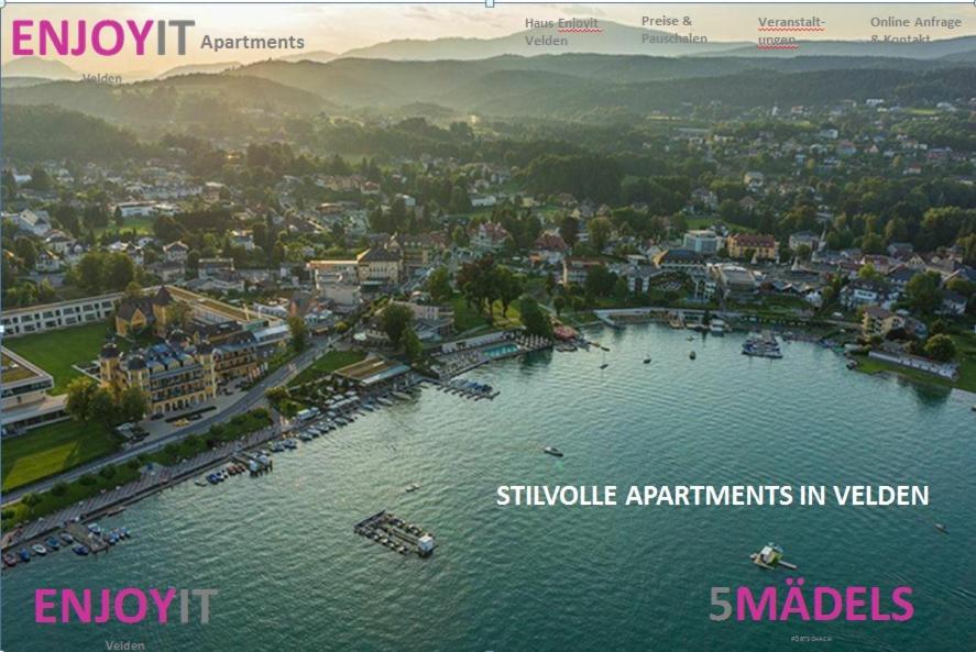 an aerial view of a city with boats in the water at Enjoyit-WS in Velden am Wörthersee