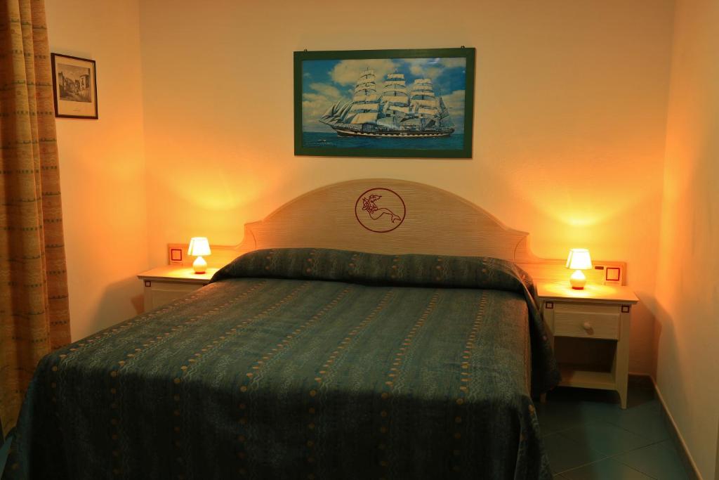 Postel nebo postele na pokoji v ubytování Hotel Oriente