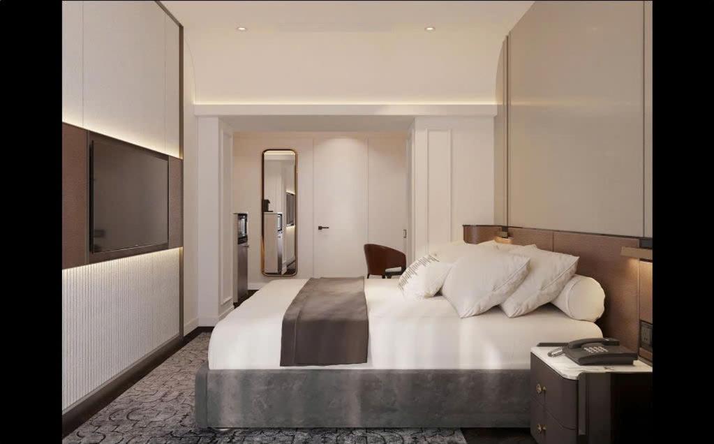 La Passion Saigon Hotelにあるベッド