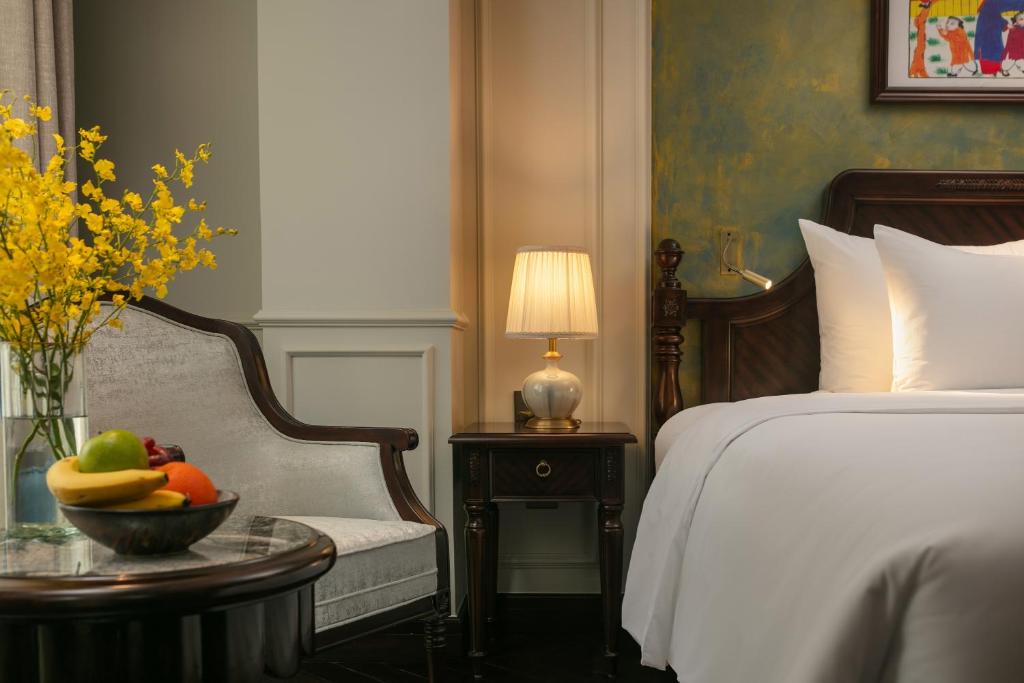 Postel nebo postele na pokoji v ubytování La Mejor Indochine Hotel
