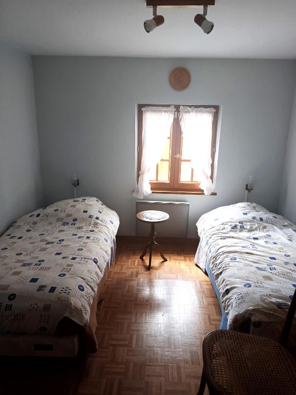 Postel nebo postele na pokoji v ubytování Gîte Hecker Alsace