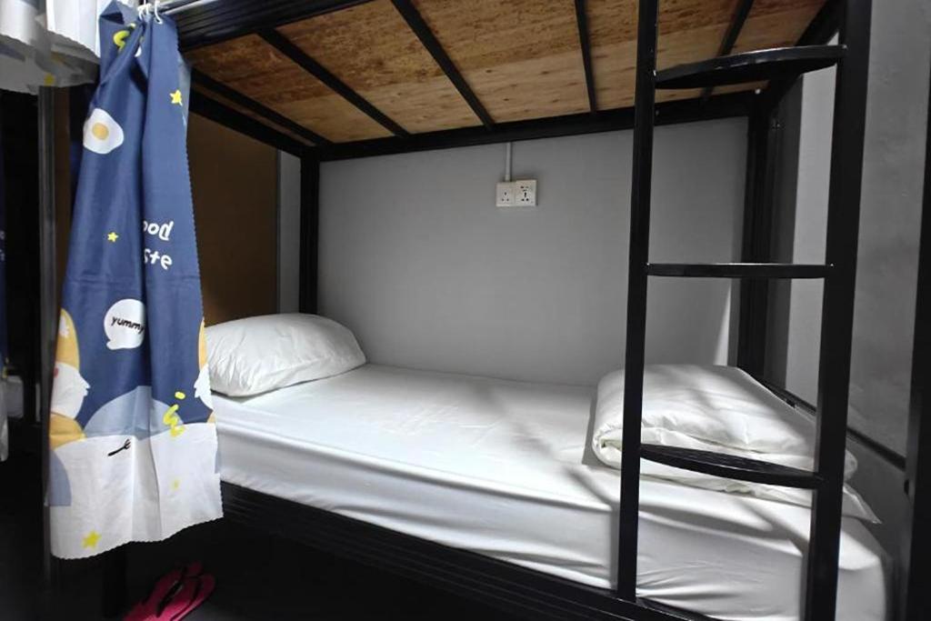 Postel nebo postele na pokoji v ubytování Makotel Hostel Ipoh