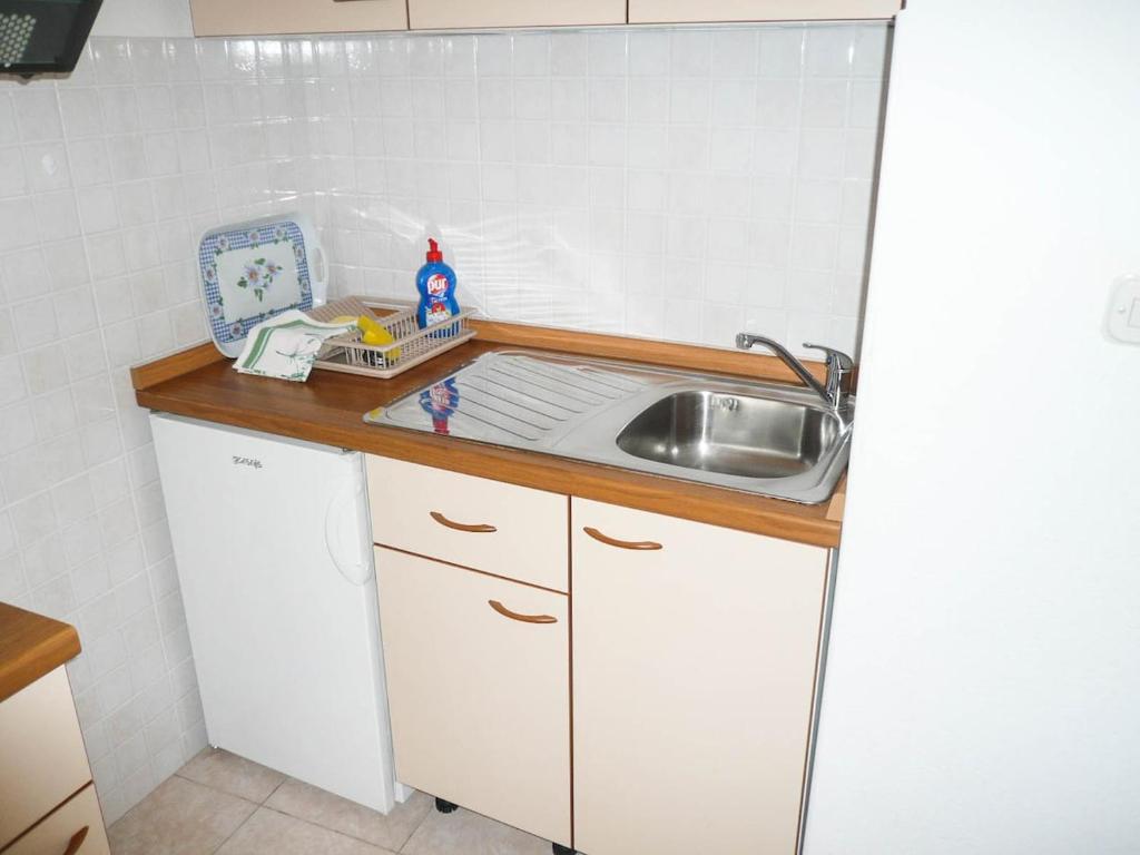 Kuchyň nebo kuchyňský kout v ubytování Apartments Šarić